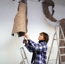 Third year sculpture student working in studio
