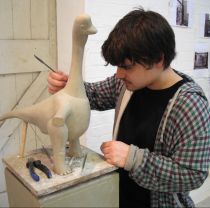 Third year sculpture student working in studio