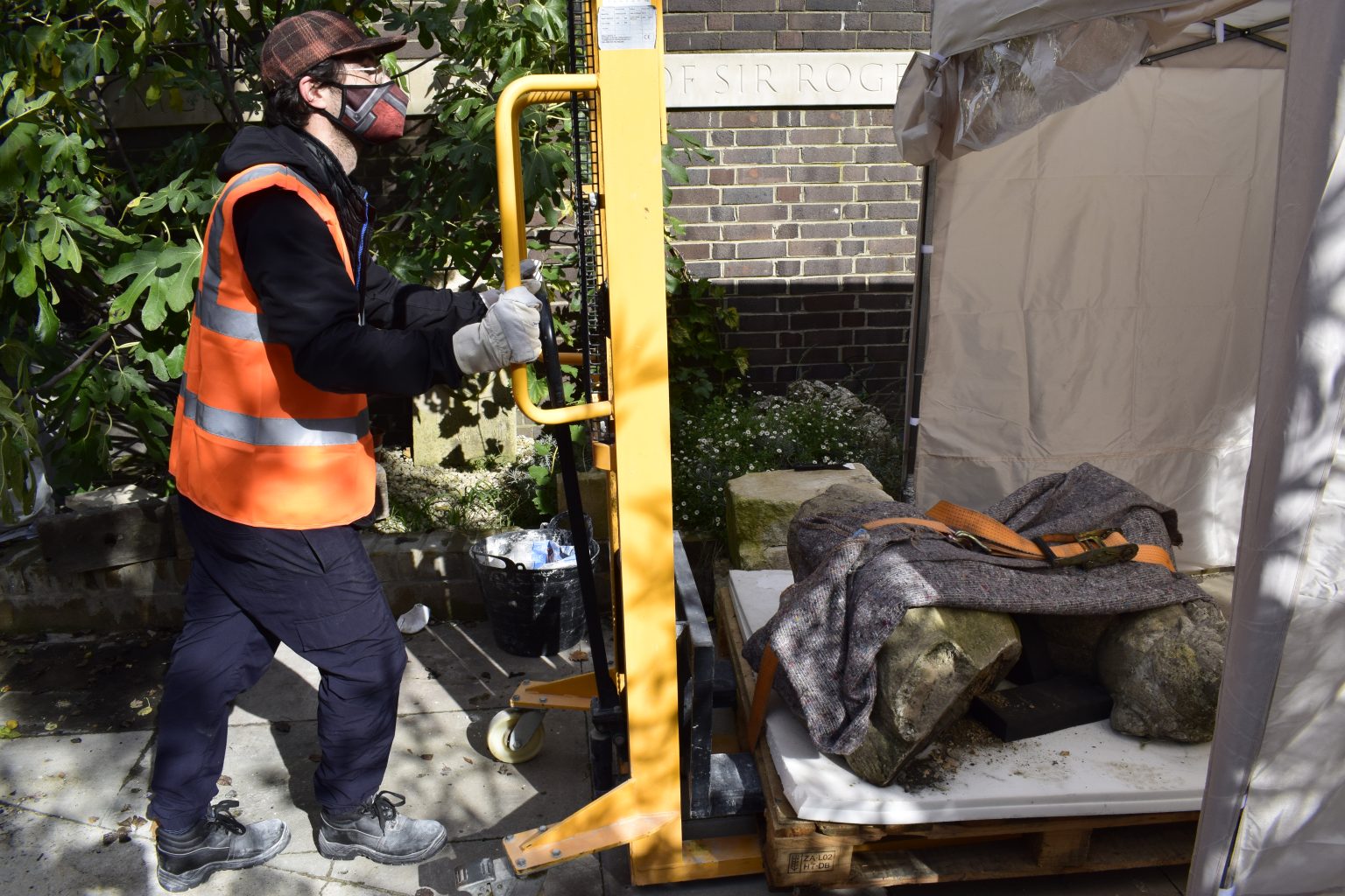 How can an Art School function during a global pandemic?- MA Conservation student with sculpture for conservation treatment How can an Art School function during a global pandemic? - Conservation student moving cultural object to be treated
