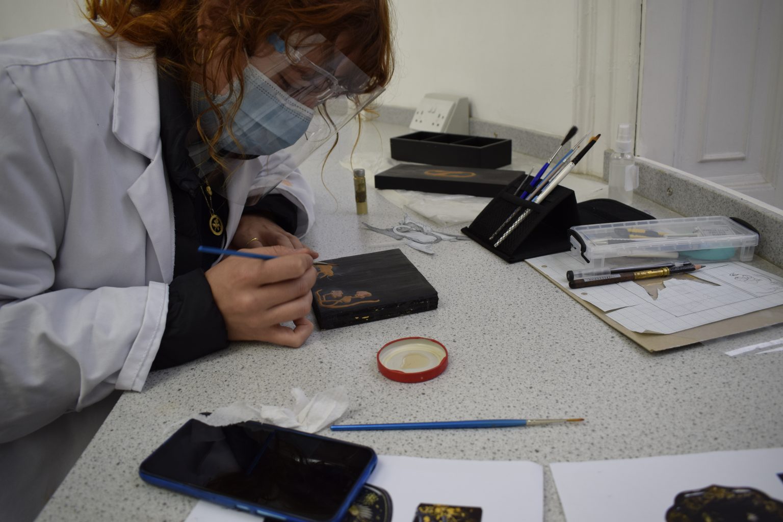 How can an Art School function during a global pandemic? - Conservation student in a japanning workshop How can an Art School function during a global pandemic? - Conservation student in a japanning workshop
